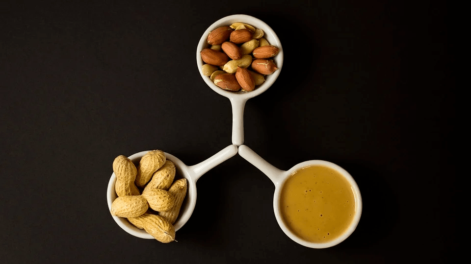 Picture of high protein snacks such as nuts and peanut butter