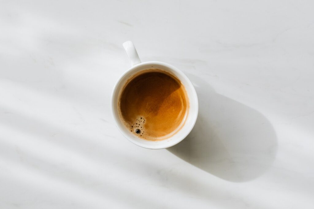 coffee_in_white_mug_on_white_table