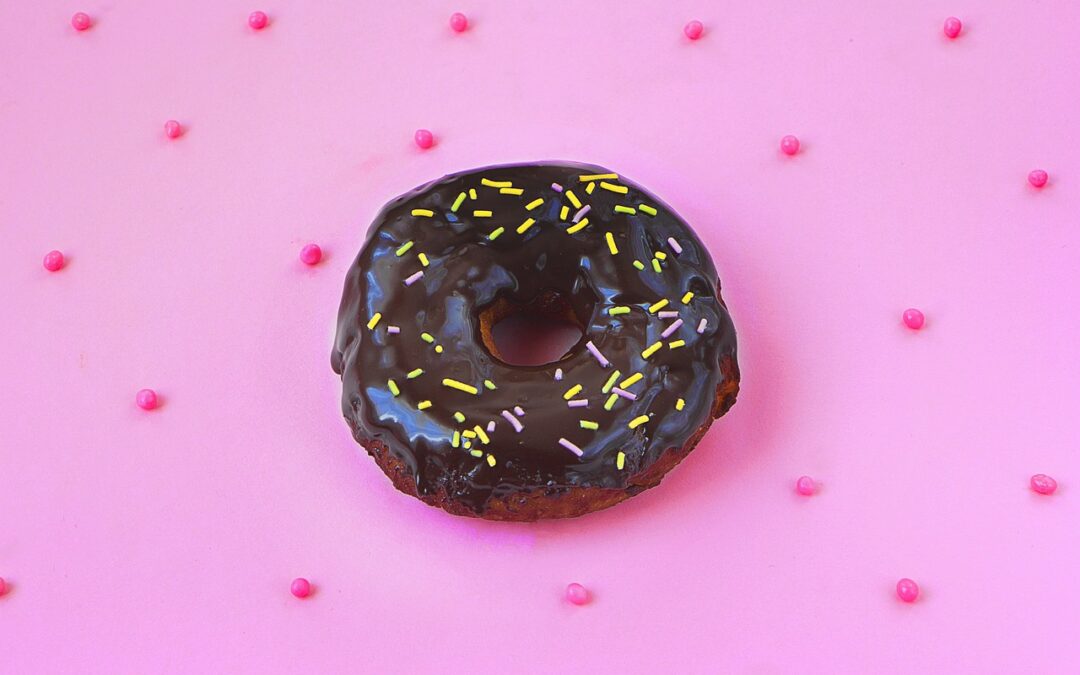 sugary_chocolate_donut_on_pink_background