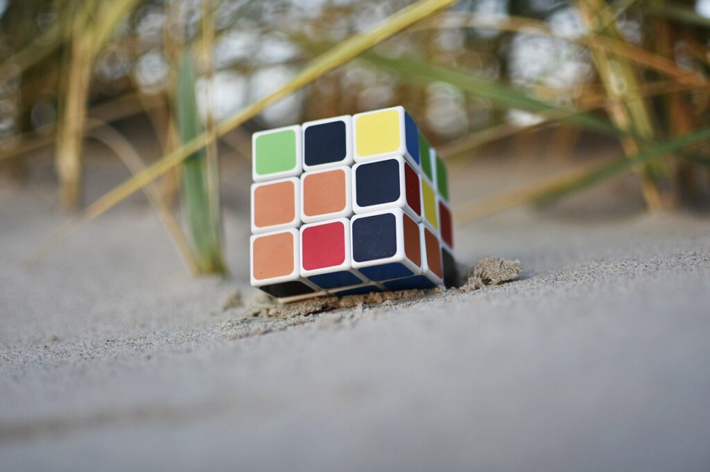 rubix cube in the sand at a beach